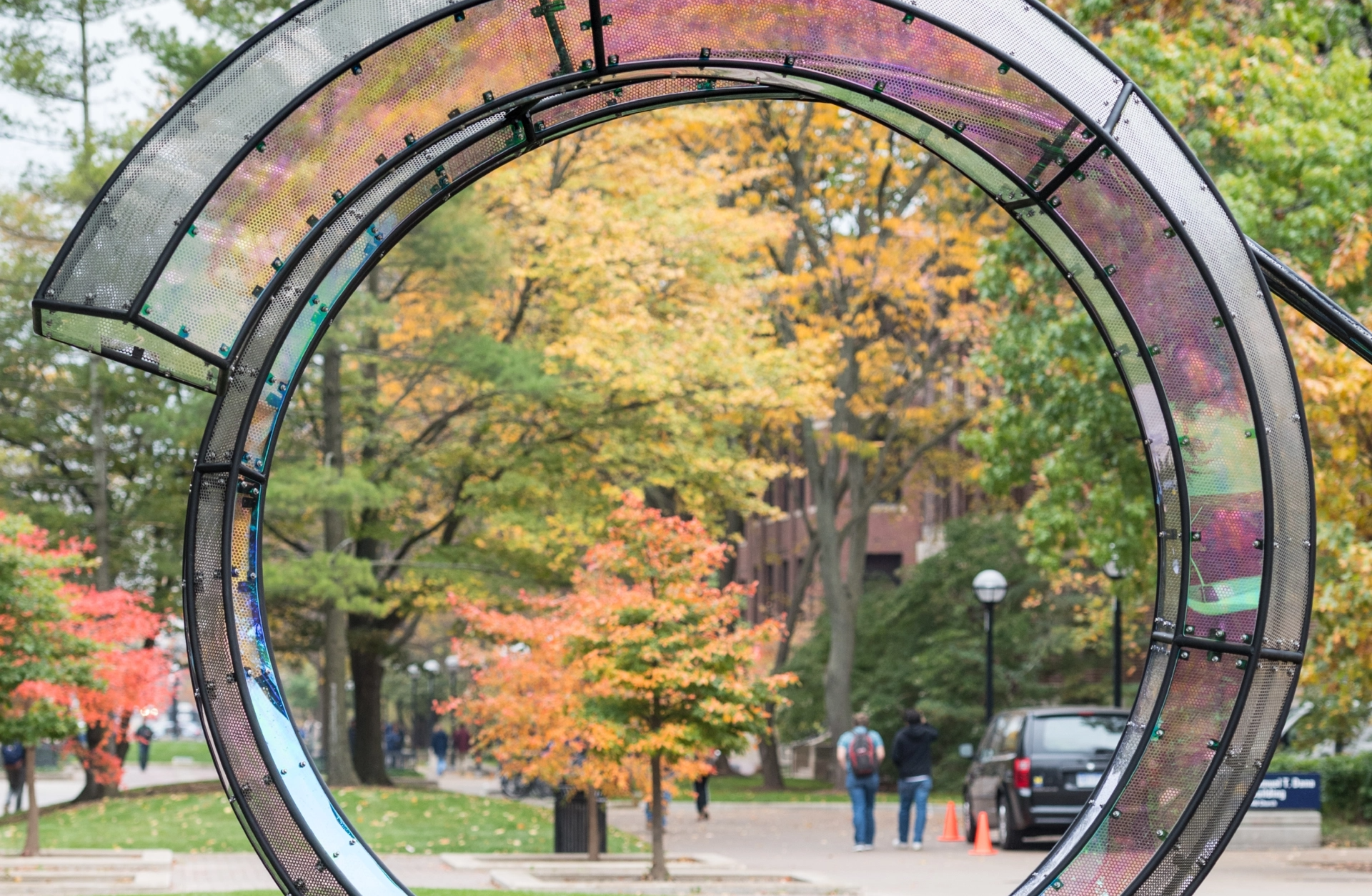 A sculpture in a spiral shape with iridescent faces