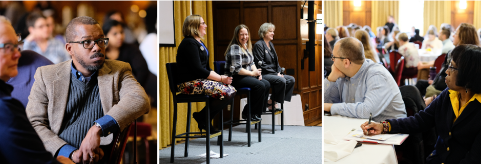 Three presenters sit with microphones on stage, smiling