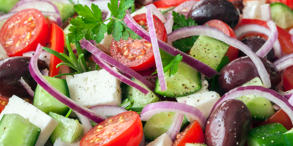 Fresh salad with Kalamata olives, cheese and herbs