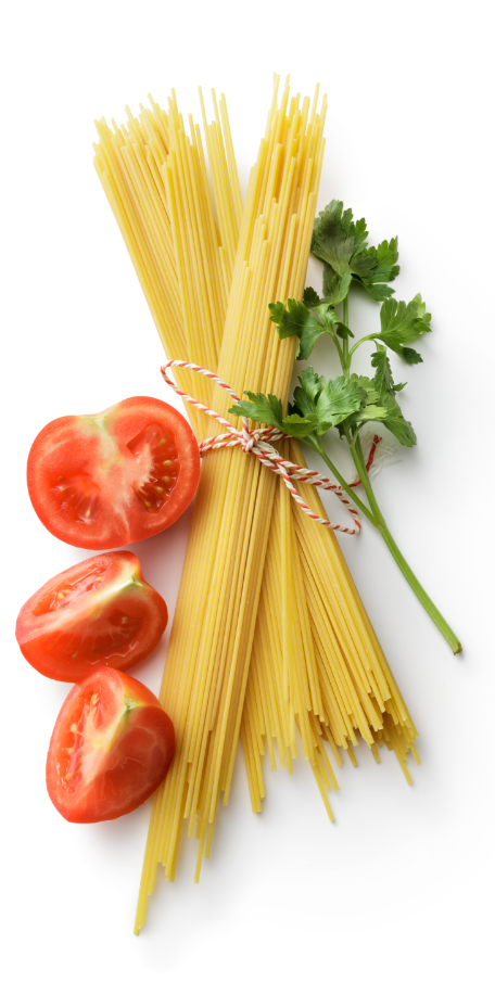 Fresh sliced tomatoes, uncooked pasta, and parsley