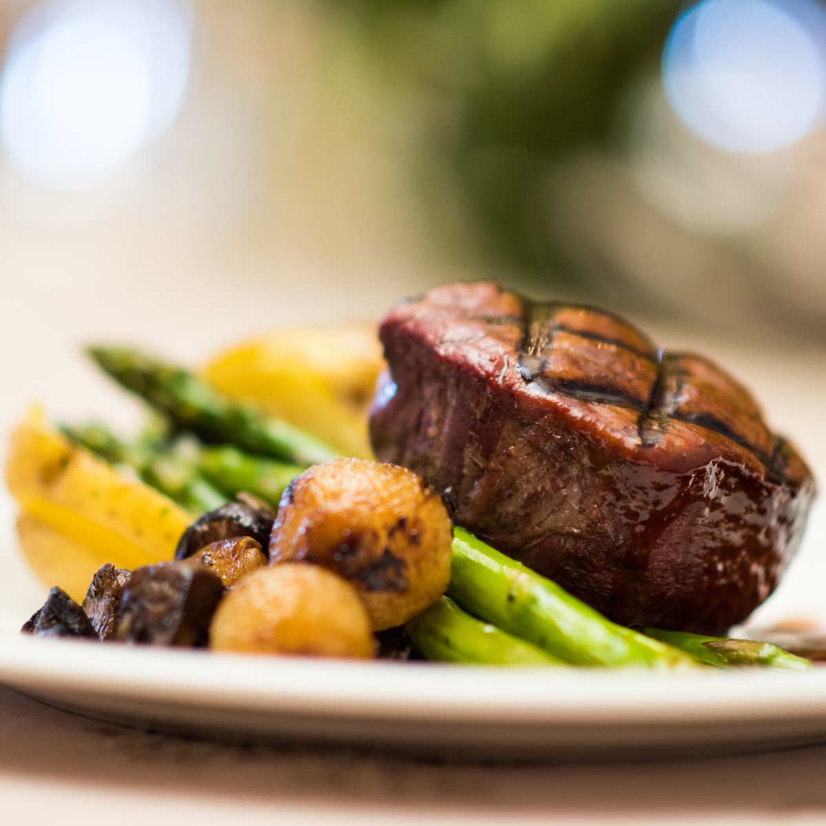 Steak and vegetables on a plate.